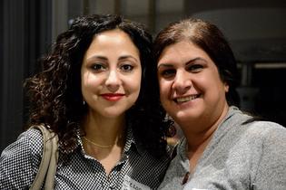 Closeup of two smiling women volunteer attorneys