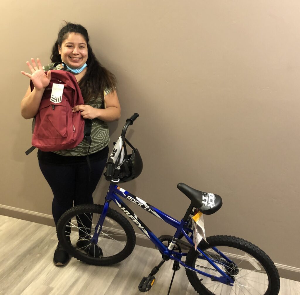 client receiving donated bike through support services